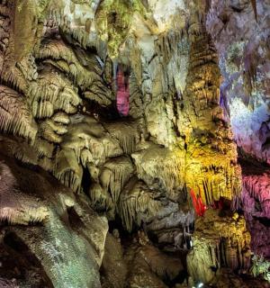 a cave with many colored walls and ceilings