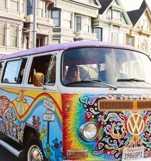 a colorful van is parked on a city street