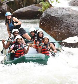 a group of people are rafting on a river
