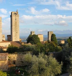 a view of a city with two towers and trees