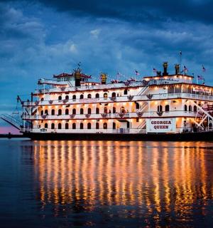 a large cruise ship on the water at night