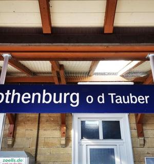 a blue sign in front of a building