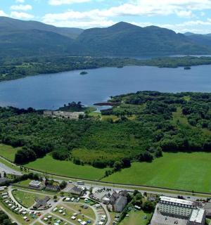 an aerial view of a lake and a city