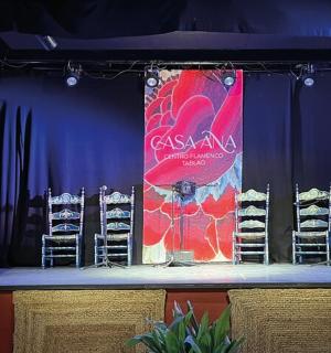 a stage with chairs and a banner on it