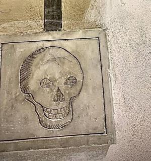 a drawing of a skull on a wall