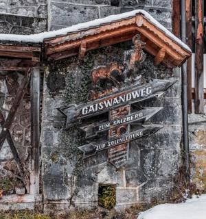 a bunch of signs on the side of a building