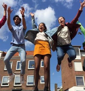 a group of young people jumping in the air
