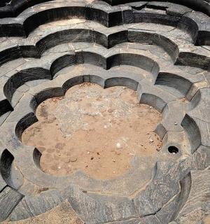 a stone floor with a spiral pattern on it