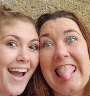 two women sticking their tongues out with their tongue