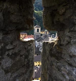 a view of a city from a rock wall
