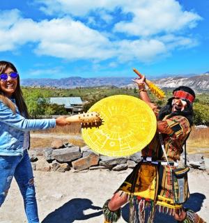 a woman standing next to a man holding a yellow umbrella