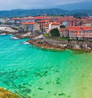 an aerial view of a beach with houses