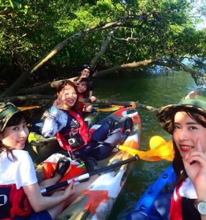 a group of people in kayaks on a river