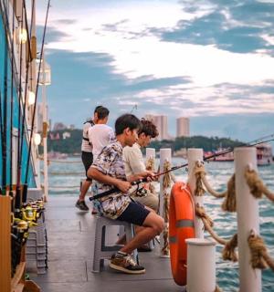 a group of people fishing on a boat