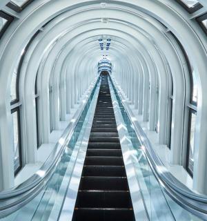 an escalator at the top of a building