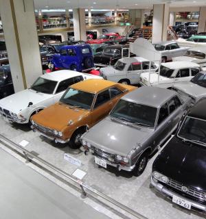 a group of cars parked in a garage