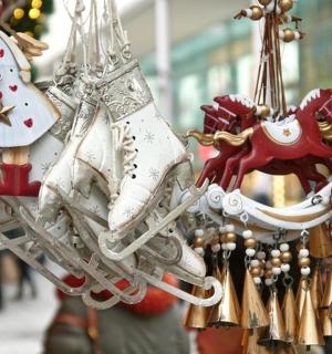 a group of christmas ornaments hanging in a store