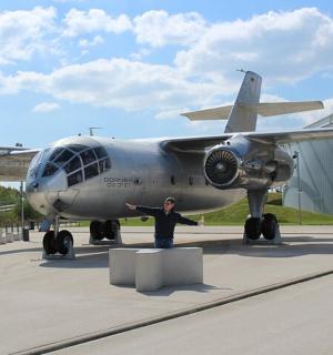 a man is standing in front of an airplane