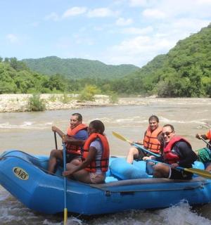 a group of people in a raft on a river