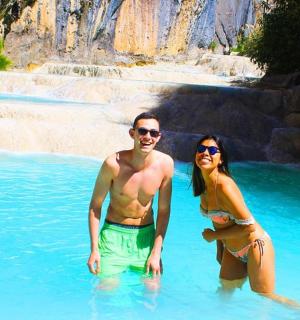 a man and a woman standing in a pool of water