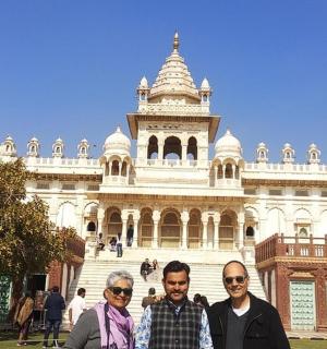a group of people standing in front of a building