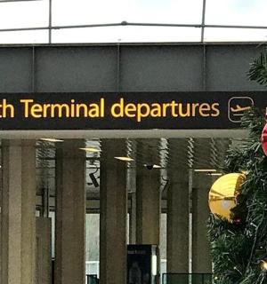 a sign that reads south terminal depolis in front of a building