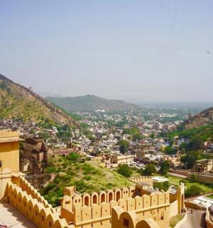 a view of a city with mountains in the background