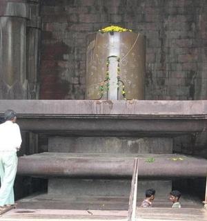 a man standing in front of a large organ