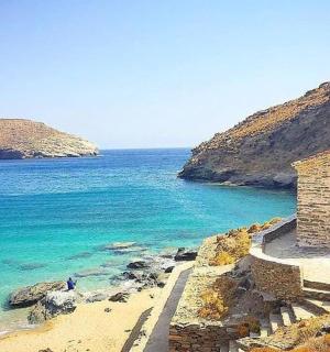 an old church on the shore of a beach