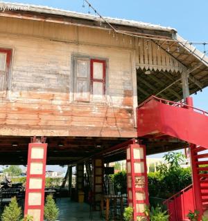 a house with a red staircase in front of it