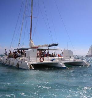 a group of people on a boat in the water