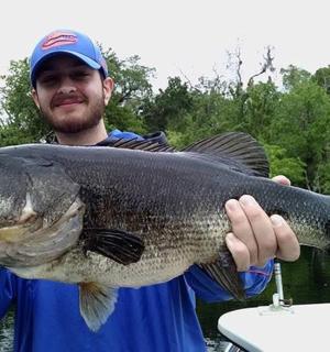 a man holding a large fish in his hand