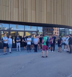 a group of people standing outside of a building