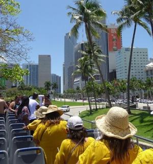 a group of people in yellow shirts on a bus