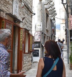 a man and a woman walking down a street