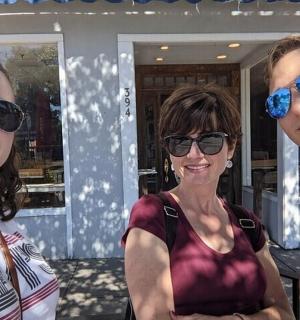 a man and two women are wearing sunglasses