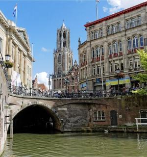 a bridge over a river in a city with buildings