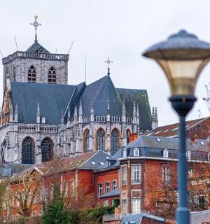 a large church with a tall tower and a street light