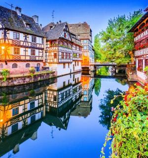 a group of buildings next to a river