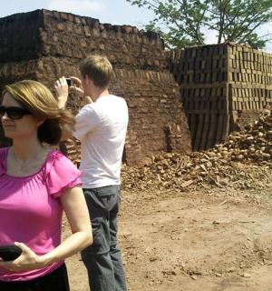 a woman taking a picture of a man taking a picture