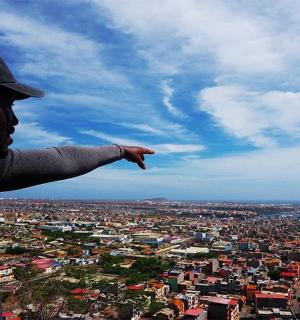 a man standing on top of a city