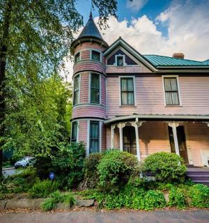 a large house with a tower on top of it