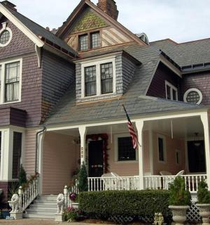 a house with an american flag in front of it