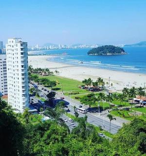 a city with a beach and a tall building