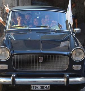 a group of people sitting in a car