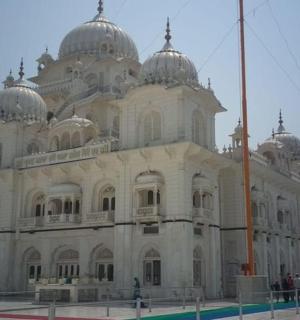 a large white building with domes on top of it