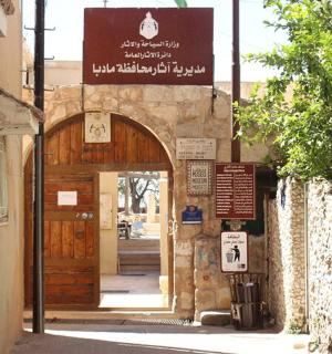 an entrance to a building with a wooden door