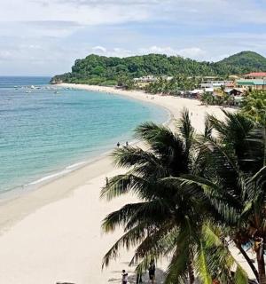a view of a beach with a boat in the water