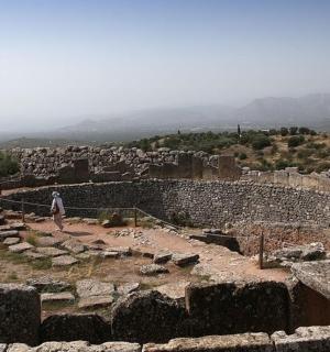 a person standing on top of a ruins