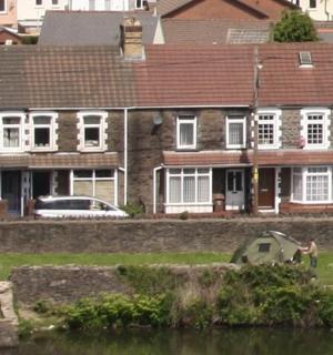 a group of houses next to a body of water